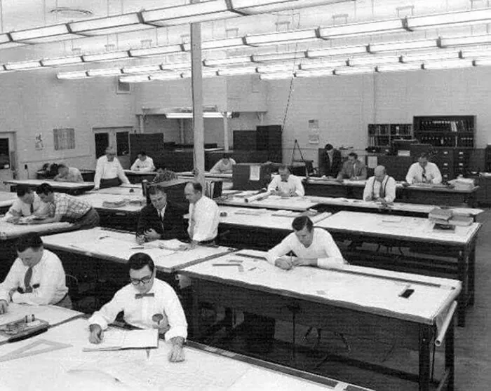 Men working in an office building. 