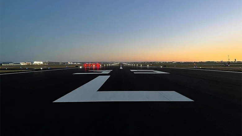 Photo of rehabilitated runway at Colorado Springs Airport with new pavement and LED lights.
