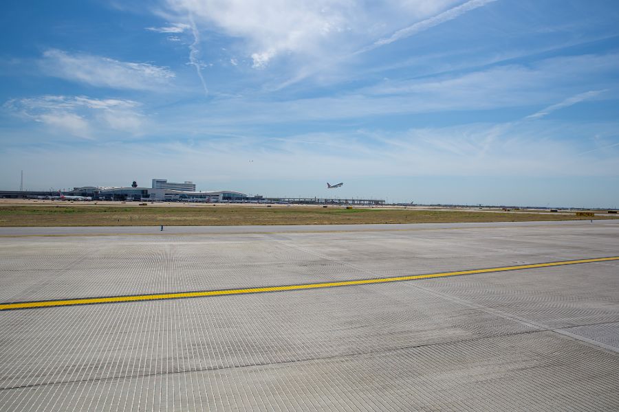 Airfield with plane taking off.