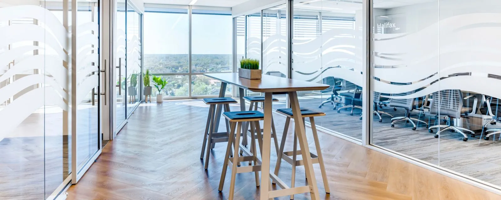 Hightop table with bar stools inside Brown & Brown Insurance headquarters.