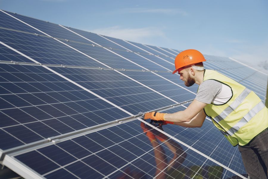 Man working on solar panels.