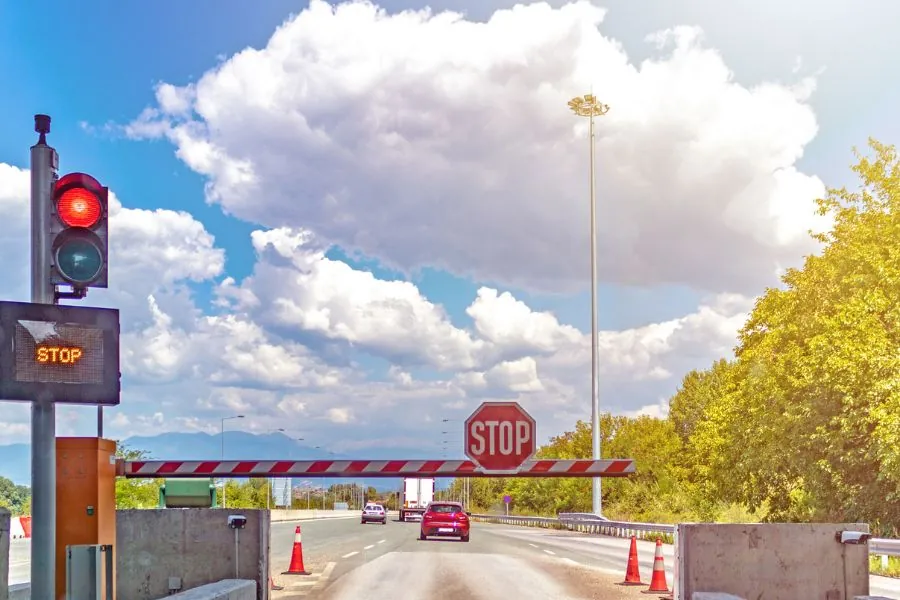 Stop sign at toll booth.