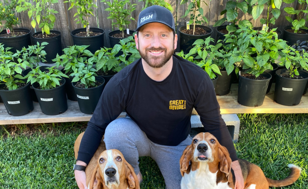 Photo of a guy with two dogs