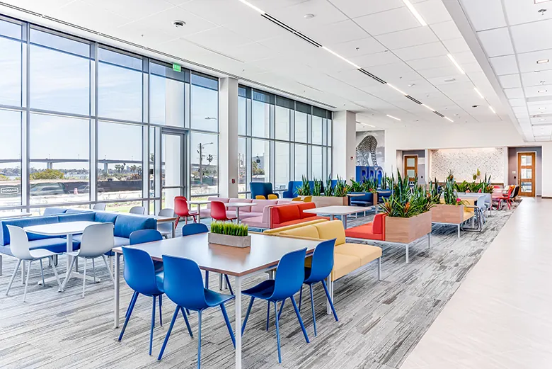 Photo of a common area with Brown and Brown's cheetah mascot artwork in their new RS&H-designed headquarters.