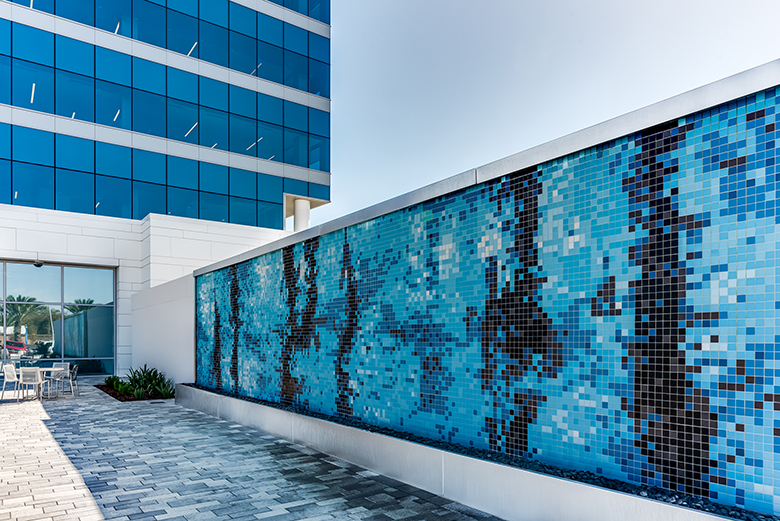 Photo of mosaic art wall on Brown and Brown's new rooftop area.
