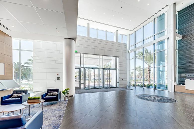 Photo of high-ceiling and glassed walls in the lobby of Brown and Brown's new headquarters.