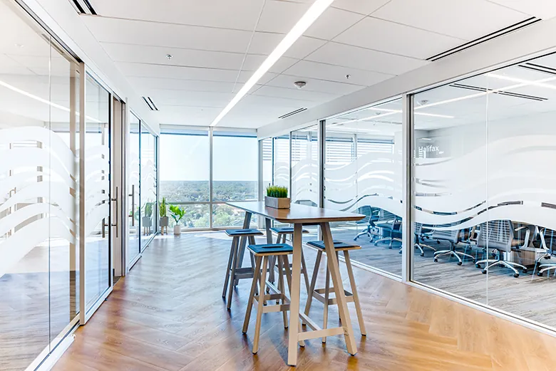 Photo of glass-walled meeting areas to maximize the view in Brown and Brown's new headquarters.