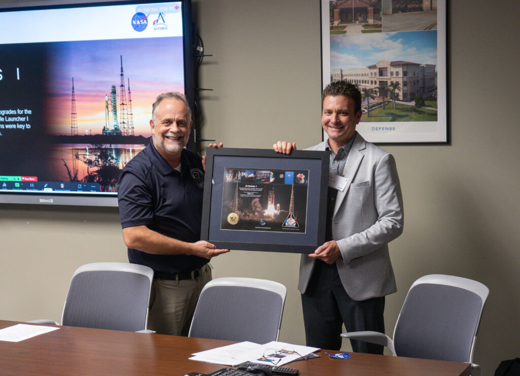 Josh accepting award from NASA