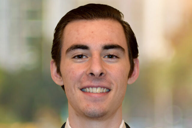 Evan Seabaugh smiling with blurred background