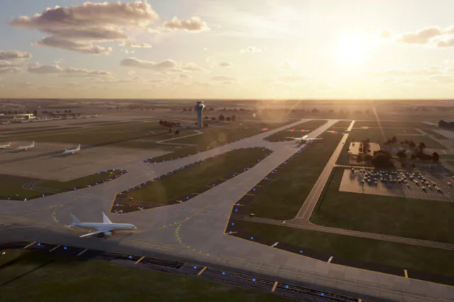 Airport runway scene at sunset with planes and control tower.